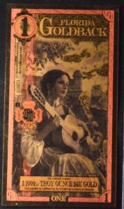 2025 1 Florida Goldback Alpha Edition Beautiful Lady Strumming Guitar PCGS 70 PPQ Supreme Gem UNC (RARE)!