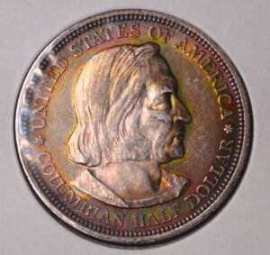 1893 MONSTER RAINBOW TONED Columbian Silver Half Dollar!